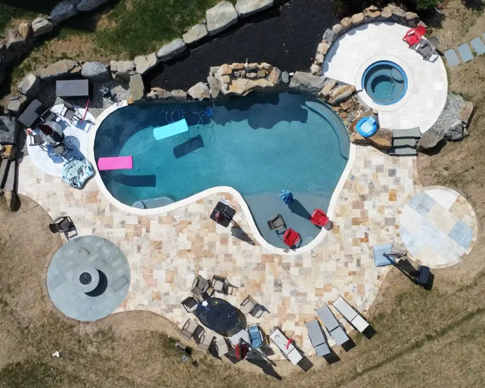 Freeform Pool, Spa & Travertine Deck — TruScapes project in Central Minnesota